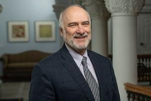 a portrait of Paul Kreider, smiling and looking at the camera